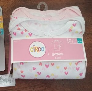 2 gowns and a baby rattle